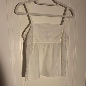 white floral sleeveless shirt